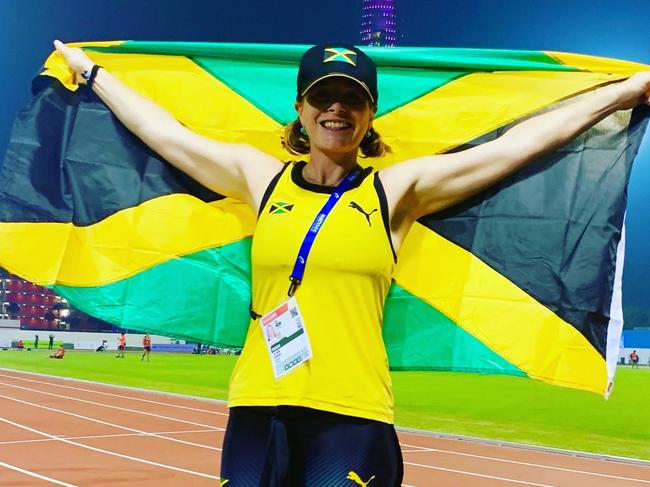 Dr Jo Brown with the Jamaican flag. Picture: Supplied.