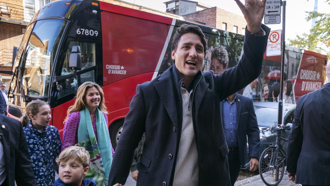 Canadian Prime Minister and Liberal leader Justin Trudeau arrives at the polling station with his son Hadrian, his wife Sophie and daughter Ella-Grace in Montreal on Monday. Picture: Paul Chiasson/The Canadian Press/AP