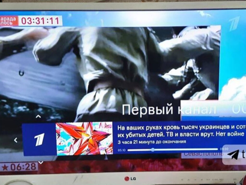 Vladimir Putin's speech was hacked and viewers were shown a message that declared Russians have blood on their hands.