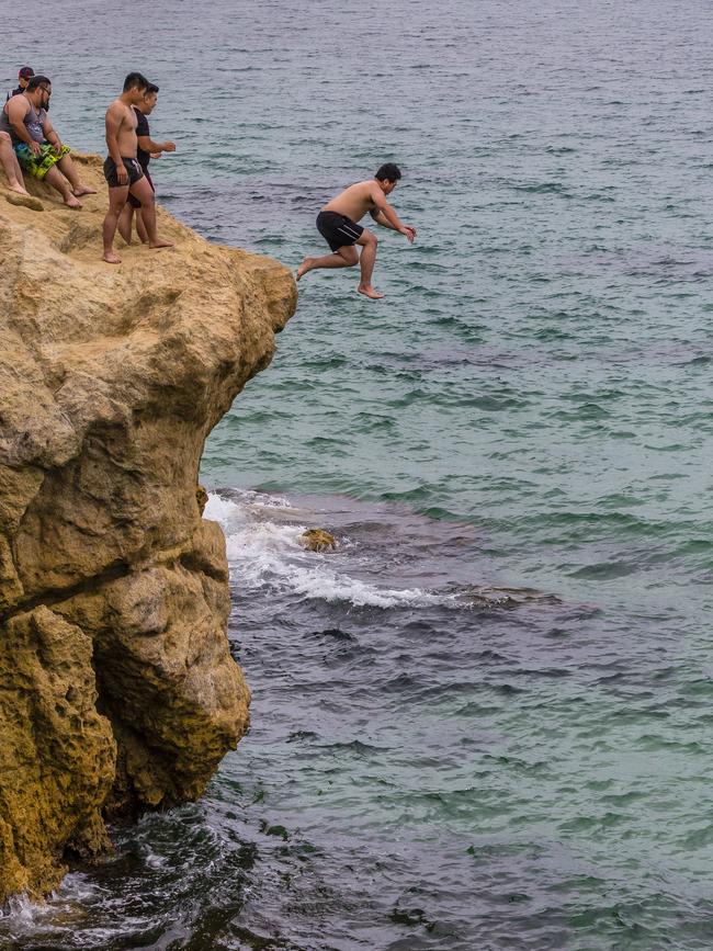 A Lifesaving Victoria representative says daredevils have suffered broken backs jumping off the cliffs. Picture: Valeriu Campan