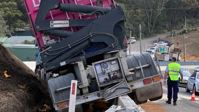 A semi-trailer left Mona Vale Rd at Ingleside and crashed over a concrete safety barrier at a roadworks construction zone. Picture: Ingleside RFS