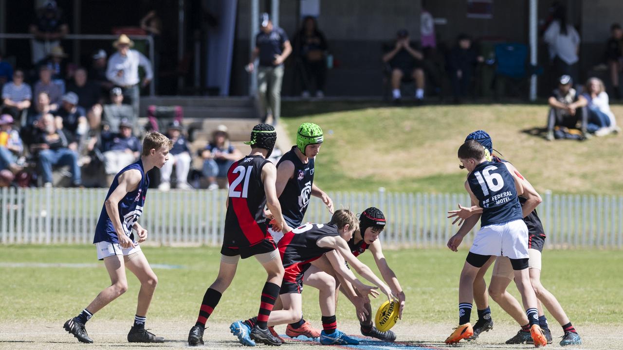 Andre Diem (centre) gets possession for South Toowoomba Bombers against Coolaroo in U14 AFL Darling Downs grand final at Rockville Park, Saturday, September 2, 2023. Picture: Kevin Farmer