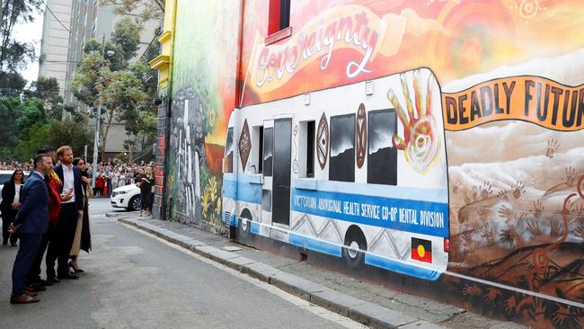 Harry and Meghan visit a mural created by Robert Young in Fitzroy. Picture: Getty