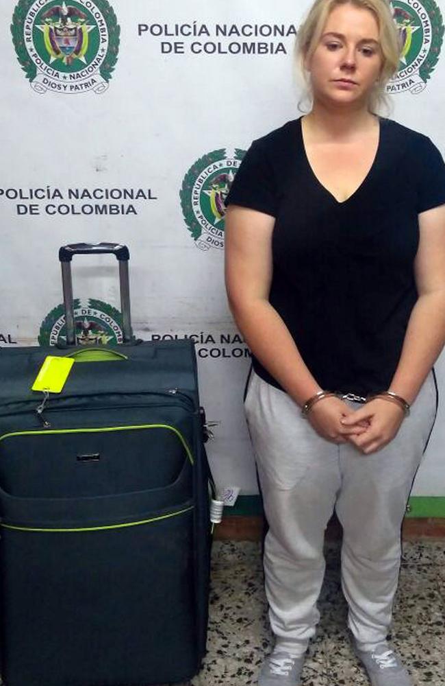 A handout photo made available by the press office of the Colombian anti-narcotics police shows the young woman with her luggage. Picture: Colombian police.