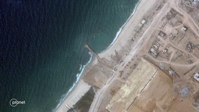 This handout satellite picture obtained from Planet Labs PBC on April 25 shows a temporary jetty on the Gaza Strip coast which was used to provide food aid. The US-made pier is nearing completion. Picture: Planet Labs Inc. / AFP