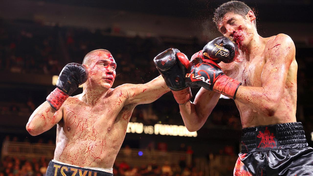 Tim Tszyu (L) connects with a punch on Sebastian Fundora.