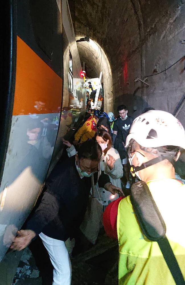 Rescuers are still scrambling to reach others trapped inside. Picture: Taiwan Red Cross/ AFP