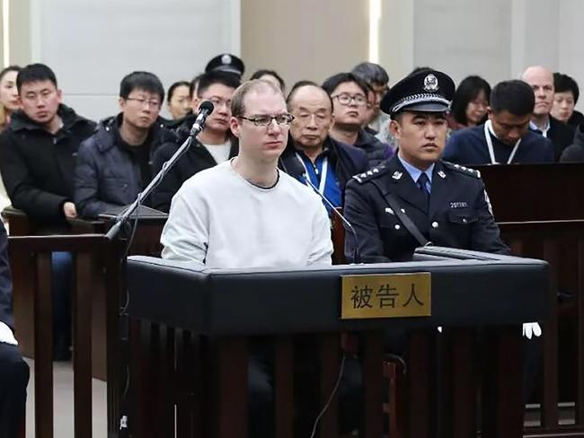 TOPSHOT - This photograph taken and released by the Intermediate Peoples' Court of Dalian on January 14, 2019 shows Canadian Robert Lloyd Schellenberg (C) during his retrial on drug trafficking charges in the court in Dalian in China's northeast Liaoning province. - The court sentenced Schellenberg to death on drug trafficking charges on January 14, 2019 after his previous 15-year prison sentence was deemed too lenient, a ruling that has deepened a diplomatic rift between Ottawa and Beijing. (Photo by HANDOUT / HO / AFP) / -----EDITORS NOTE --- RESTRICTED TO EDITORIAL USE - MANDATORY CREDIT "AFP PHOTO / Intermediate Peoples' Court of Dalian" - NO MARKETING - NO ADVERTISING CAMPAIGNS - DISTRIBUTED AS A SERVICE TO CLIENTS - NO ARCHIVES