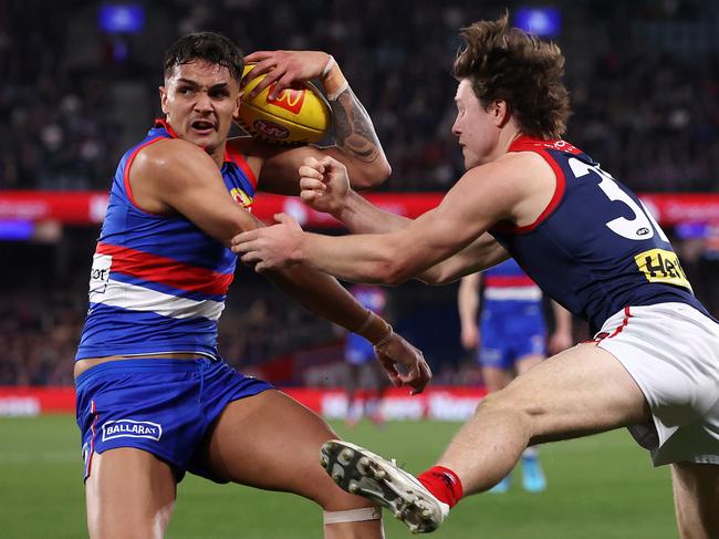 MELBOURNE, AUGUST 2, 2024: 2024 AFL Football - Round 21 - Western Bulldogs V Melbourne Demons at Marvel Stadium. Jamarra Ugle-Hagan of the Bulldogs under pressure. Picture: Mark Stewart