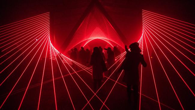 Revellers enjoying the laser installation at Dark Park. Picture: ALASTAIR BETT