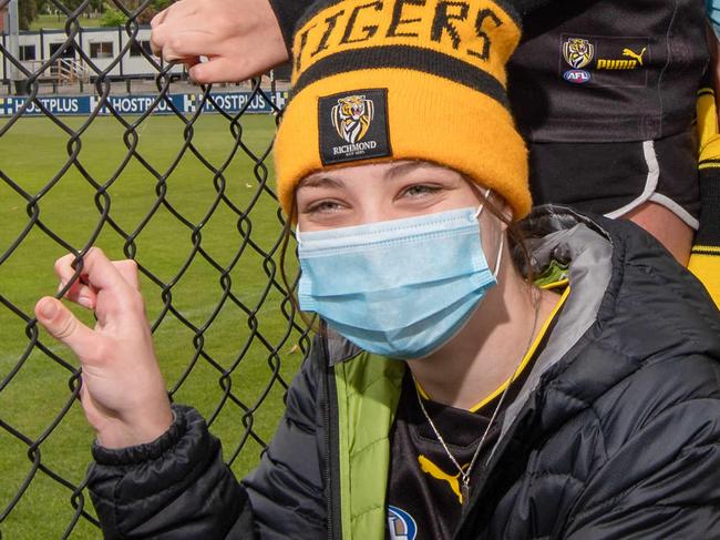 The lowther family have come from Eltham to see the empty oval. 0418367050Paige, Sarah, Nicole, Abi and Brad   Richmond wins the AFL 2020 grand final Images from Richmond lockdown Punt Road Oval. Fans walk past with police patrolling the area. Picture: Jason Edwards