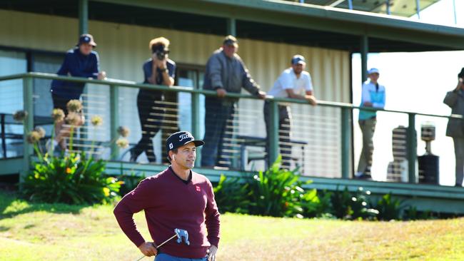 Local Maleny Golfers watch Professional Adam Scott on the 18th at the Maleny Golf Club. Photo Lachie Millard