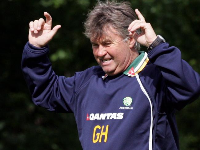 Socceroos coach Guus Hiddink celebrates after he hit crossbar in competition with other coaches for a bottle of wine during Australia team World Cup 2006 training session while in camp in Mierlo, The Netherlands, 29/05/06, before heading off for finals in Germany.