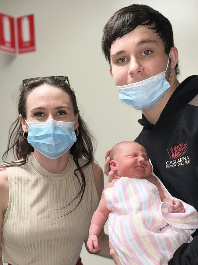 18-year-old Kingsley 'Junior' Alley holding his newborn daughter Eleanor, with stepmum Kylie Simmonds. Kingsley was murdered at Palmerston.