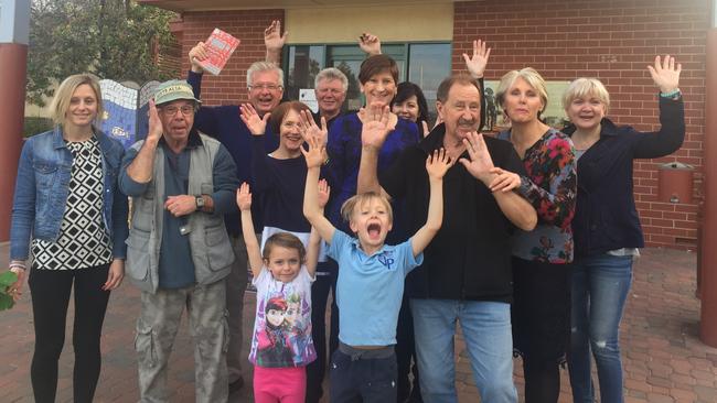 Residents celebrate the Henley Library staying open.