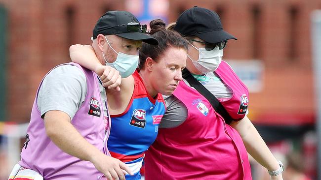 Lochland is taken from the ground after her heavy collision. Picture: AFL Photos via Getty Images