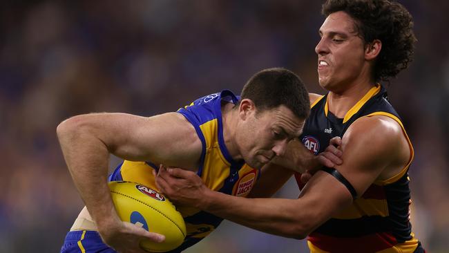 James Borlase of the Crows tackles Jeremy McGovern of the Eagles during the round 24 AFL match between West Coast and Adelaide at Optus Stadium. Picture: Paul Kane/Getty Images