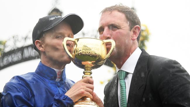 Kerrin McEvoy and trainer Cahrlie Appleby share the spoils of victory. Picture: Getty Images