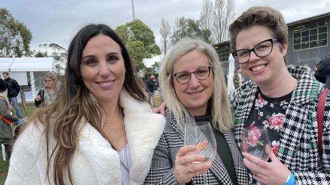 A glass or three of wine and winter woollies helped keep these friends warm (left to right) Natalie Ellisdon, Elwood, Amanda Holenstein, Hampton, Sarah Lanzafame, Hampton. Picture: Lucy Callander