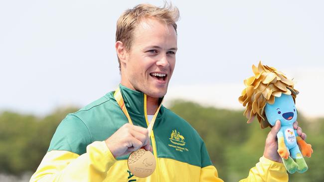 Curtis McGrath of Australia poses on the medals podium after winning the men's KL2 final at Lagoa Stadium during day 8 of the Rio 2016 Paralympic Games. (Photo by Matthew Stockman/Getty Images)