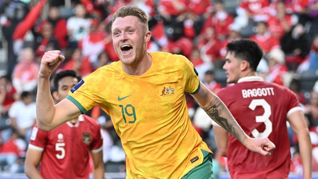 Australia's defender #19 Harry Souttar celebrates scoring his team's fourth goal during the Qatar 2023 AFC Asian Cup football match between Australia and Indonesia at the Jassim bin Hamad Stadium in Doha on January 28, 2024. (Photo by HECTOR RETAMAL / AFP)