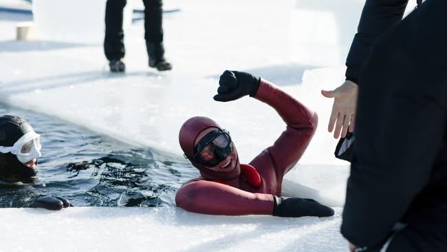 Ant Williams emerges after breaking a world record for the longest swim under ice using a single breath.