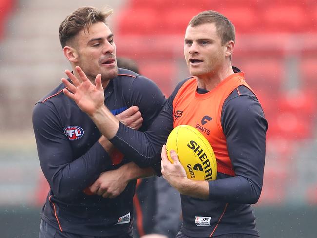 SYDNEY, AUSTRALIA - JUNE 27:  Stephen Coniglio of the Giants and Heath Shaw of the Giants interact during a Greater Western Sydney Giants AFL training session at Spotless Stadium on June 27, 2018 in Sydney, Australia.  (Photo by Cameron Spencer/Getty Images)