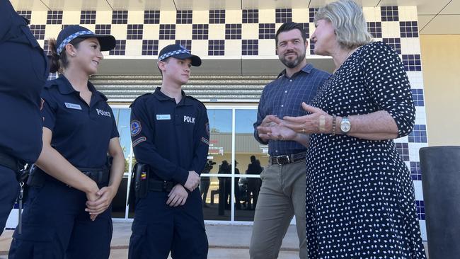 Auxiliary officers Sophia Prentos and Zac Conelius speak to Police Minister Brent Potter and Chief Minister Eva Lawler.