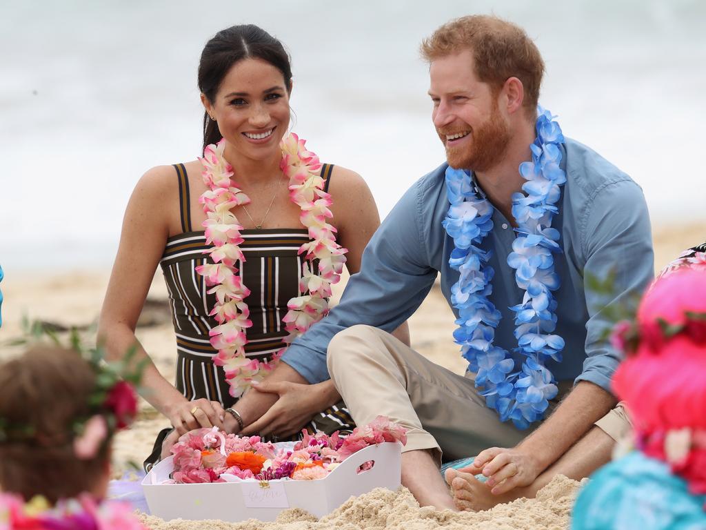 Prince Harry, Duke of Sussex and Meghan, Duchess of Sussex talk to members of OneWave, an awareness group for mental health and wellbeing at South Bondi Beach on October 19, 2018. Picture: Getty