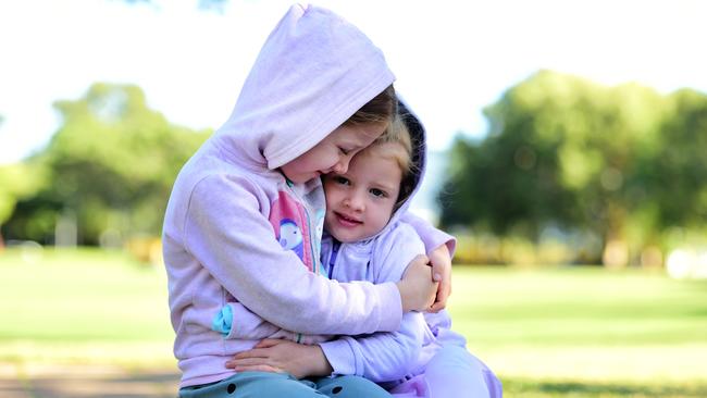 Weather; Annabel 6 and Zoe Graham 4 rugged up on the Strand.