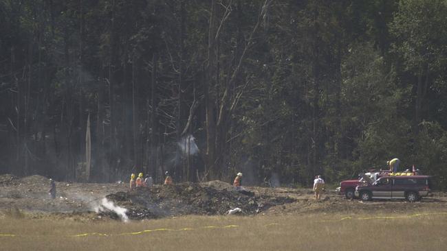 Emergency personnel mark off the crash site of United Airlines Flight 93 near Somerset, Pennsylvania. The hijacked Boeing 757 took off from Newark, New Jersey, en route to San Francisco when it crashed in a wooded. There were no survivors.