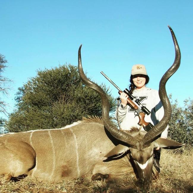 Paige with a dead kudu antelope in Africa.