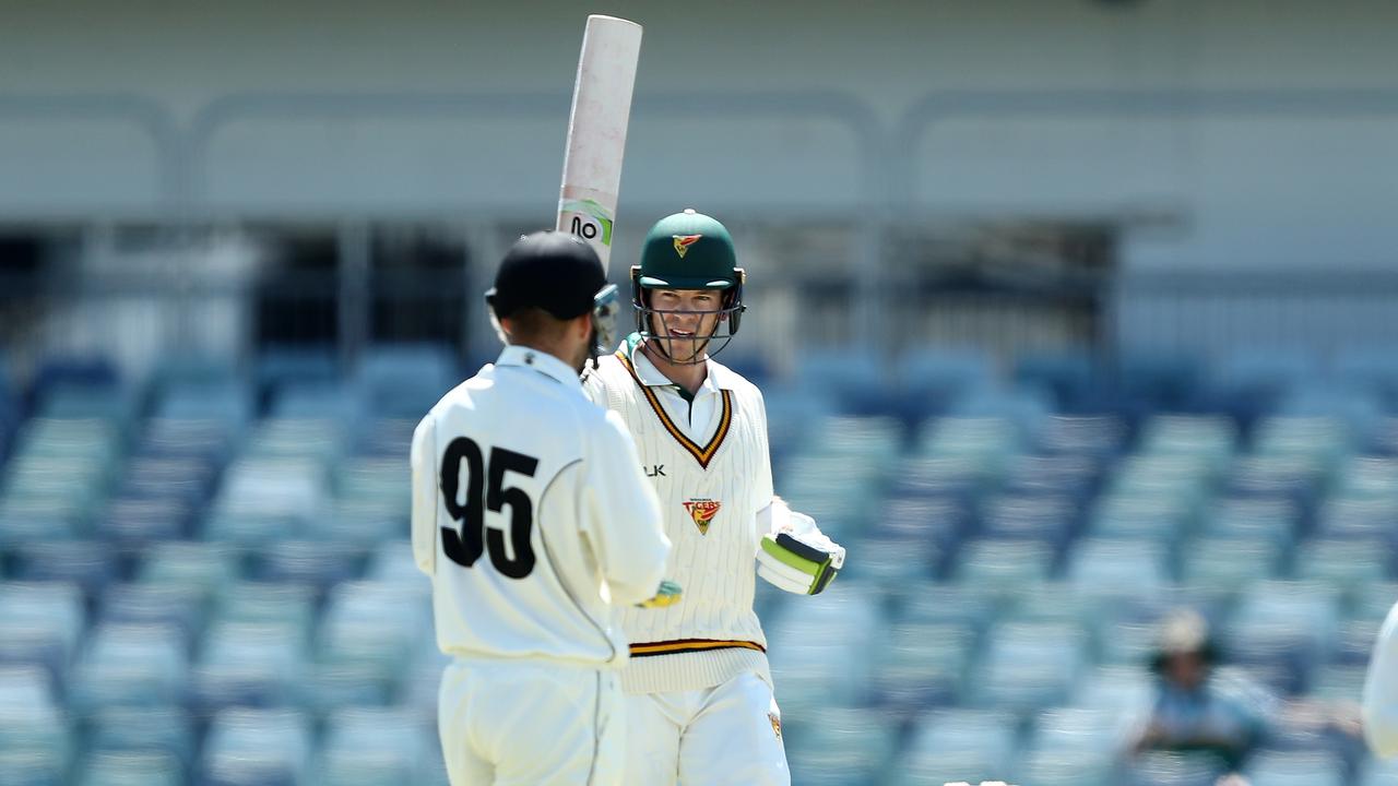 Tim Paine of Tasmania celebrates reaching his century against WA. Picture: Gary Day