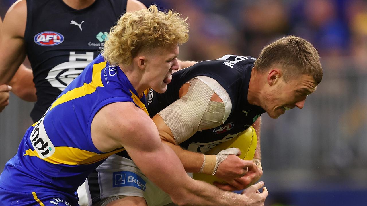 PERTH, AUSTRALIA - APRIL 29: Reuben Ginbey of the Eagles tackles Patrick Cripps of the Blues during the round seven AFL match between the West Coast Eagles and Carlton Blues at Optus Stadium, on April 29, 2023, in Perth, Australia. (Photo by Paul Kane/Getty Images)