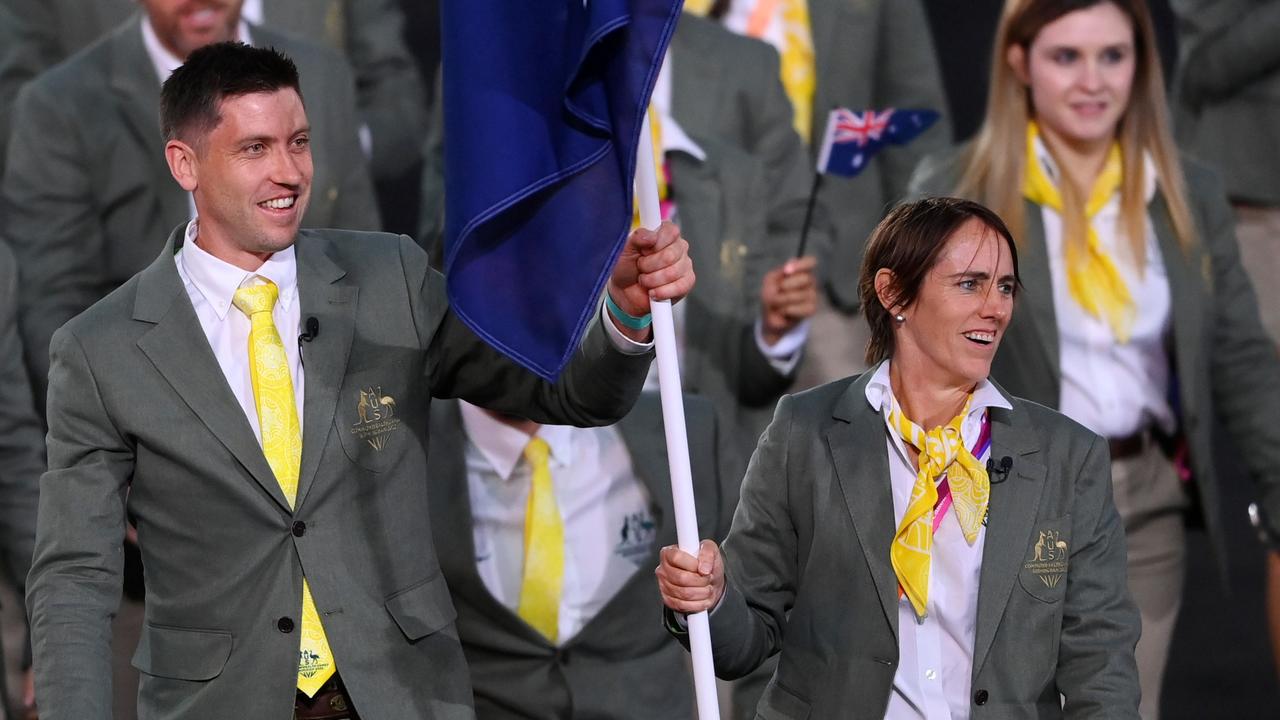 BIRMINGHAM, ENGLAND - JULY 28: Eddie Ockenden and Rachael Grinham, Flag Bearers of Team Australia lead their team out during the Opening Ceremony of the Birmingham 2022 Commonwealth Games at Alexander Stadium on July 28, 2022 on the Birmingham, England. (Photo by Alex Davidson/Getty Images)