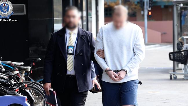 Mark Chikarovski during the arrest. Photo: NSW Police