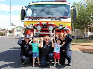 TOY RUN: Firefighters Russell Schwerin, Cheryl Schwerin and Sandran Hayward with Tyasha and Blayze Bullock doing their best reindeer impressions. Picture: Shannon Hardy