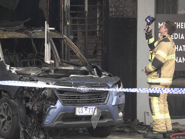 MELBOURNE,AUSTRALIA-NewsWire Photos 15 SEPTEMBER, 2024: Multiple Triple Zero calls were received for a vehicle into a shop on High St, Thornbury with FRV crews arriving on scene within 5 minutes, the vehicle wasreported as fully involved by fire inside the structure. Fire fighting crews donned breathing apparatus and commenced firefighting operations to containthe fire which was threatening to spread into shops on either side. At 04:20hrs the fire was given Under Control status and had been contained within the shop with no spread into adjoining businesses.. Picture: NewsWire / Valeriu Campan