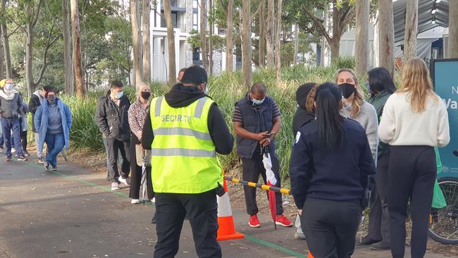 People lining up at 8.30am on Sunday at the Homebush vaccination hub. Picture: Adam Yip