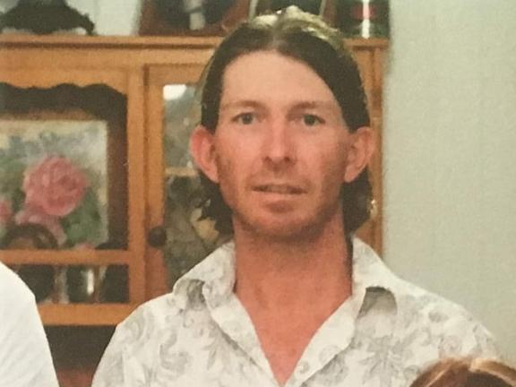 Troy William McGinnity (back row, third from the left, white shirt with silver pattern, top two buttons undone with neck length brown hair and scruffy beard) was sentenced to three and a half years' jail for drug trafficking.