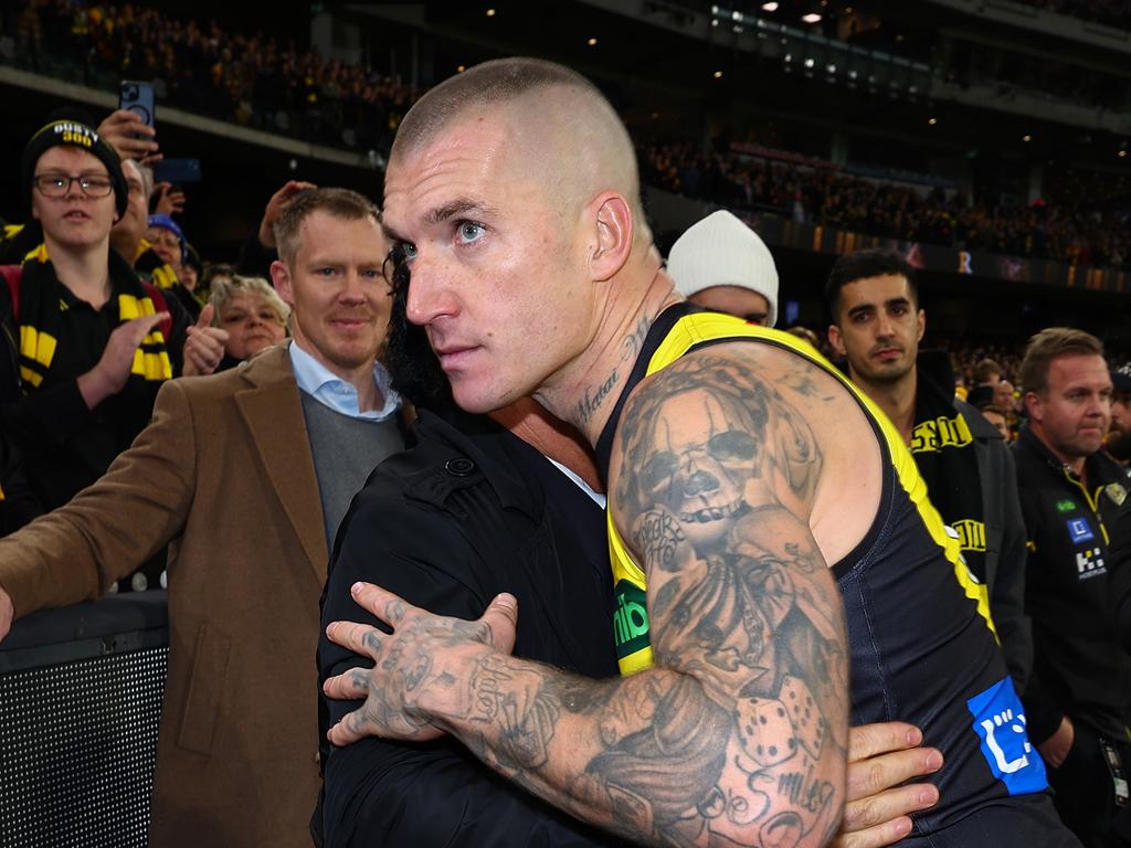 MELBOURNE, AUSTRALIA – JUNE 15: Dustin Martin of the Tigers embraces his agent Ralph Carr following his 300th match the round 14 AFL match between Richmond Tigers and Hawthorn Hawks at Melbourne Cricket Ground on June 15, 2024 in Melbourne, Australia. (Photo by Graham Denholm/Getty Images)