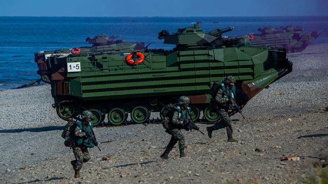 Soldiers disembark from AAV7 amphibious assault vehicles during the Han Kuang military exercise, which simulates China's People's Liberation Army (PLA) invading the island, in Pingtung, Taiwan.