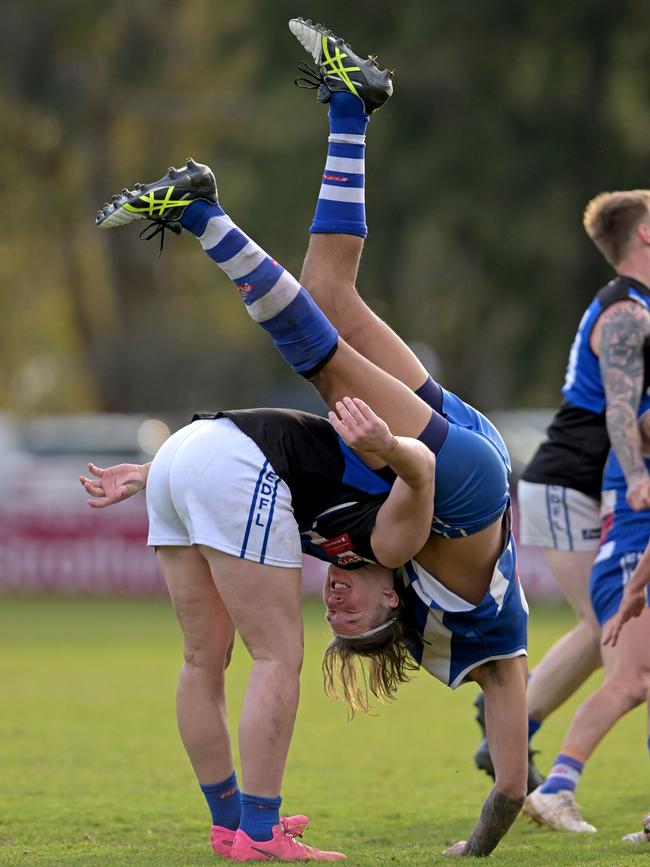 EDFL: Zach Graham of Oak Park goes over the top of Sunbury Kangaroo Jordan James. Picture: Andy Brownbill