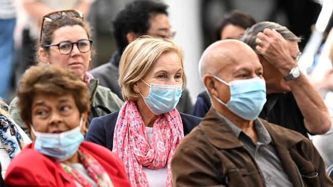 People ware face masks in central Brisbane in 2022. Picture: NCA NewsWire / Dan Peled