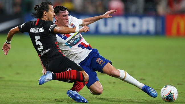 Daniel Georgievski, left, of the Western Sydney Wanderers is challenged by Matthew Millar of the Newcastle Jets during the round-19 A-League match in Sydney on Saturday. Picture: Getty Images