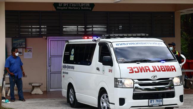 The body of Shane Warne is transported in an ambulance from the mortuary of the Koh Samui Hospital. (Photo by Jack TAYLOR / AFP)