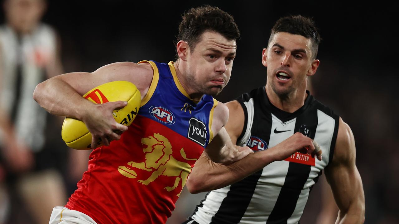 MELBOURNE, AUSTRALIA - August 18, 2023. AFL . Lachie Neale of the Lions fends off Scott Pendlebury of the Magpies during the round 23 match between Collingwood and the Brisbane Lions at Marvel Stadium in Melbourne, Australia. Photo by Michael Klein.