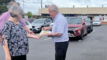 Bundaberg Regional Council Division 8 councillor Steve Cooper hands out flyers supporting Jack Dempsey in his federal election race.