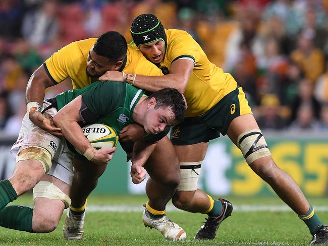 Bringing the pain (right) with Taniela Tupou in Brisbane. Picture: AAP