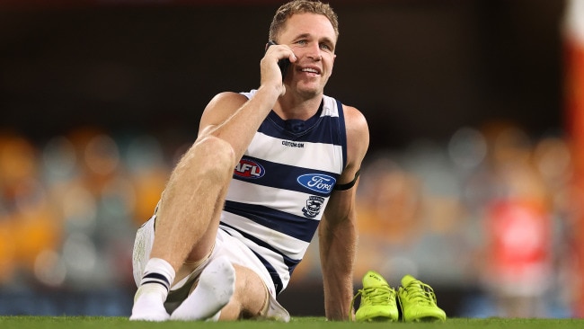 Joel Selwood takes a phone call after Geelong's preliminary final win. Picture: Michael Klein